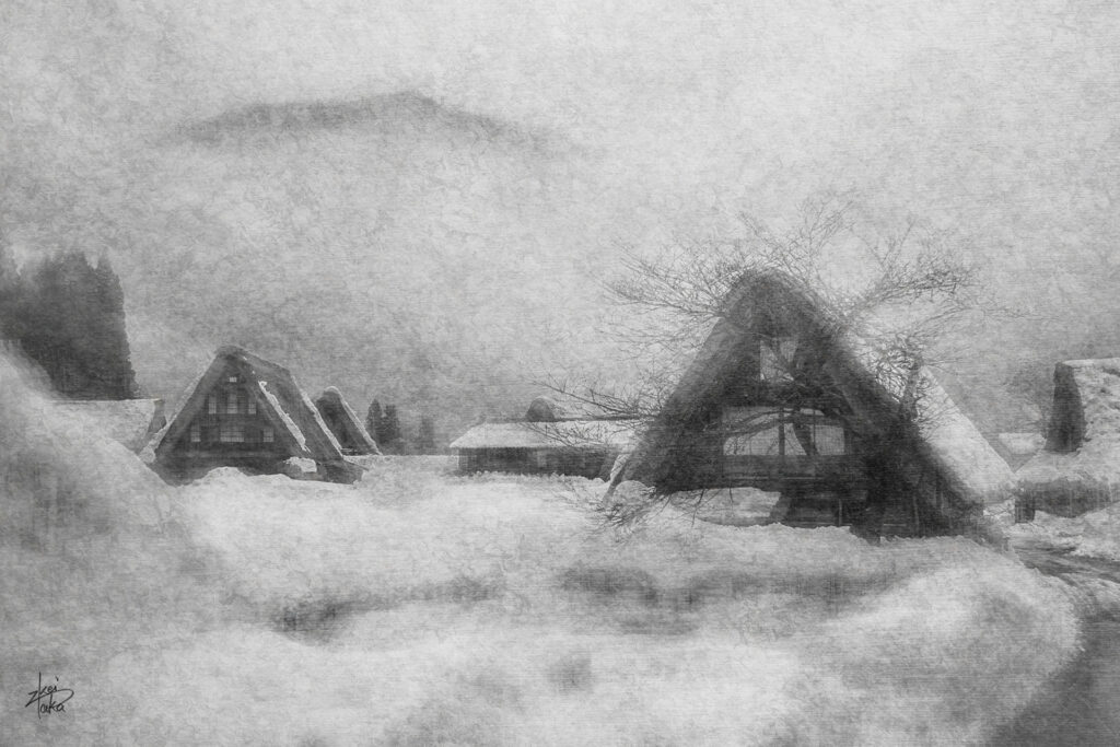 Black and white work of snowy landscape of the historical Gassho-Zukuri Village in Shirakawa-go, a World Heritage Site in Japan.