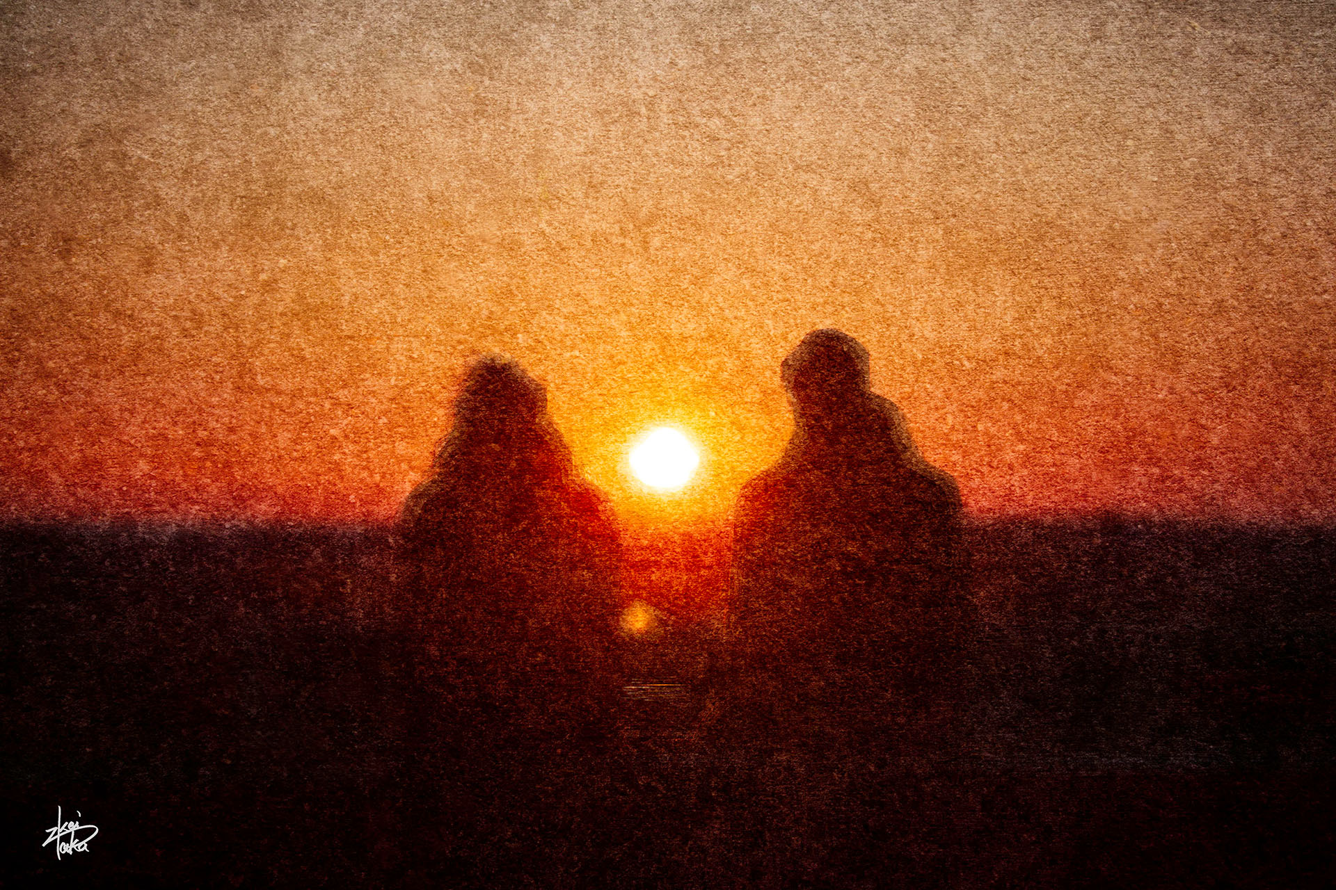 A couple watches the sunset from a park in the old town of Estonia.