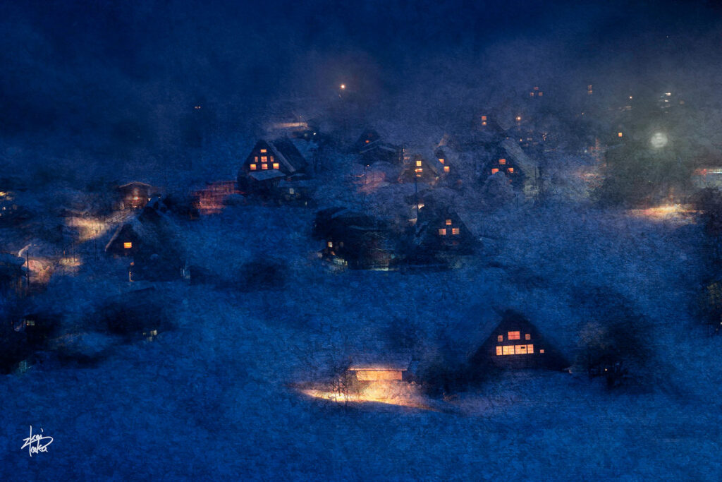 Winter illuminated night view of the historic gassho-zukuri village of Shirakawa-go, a World Heritage Site in Japan, from the observation platform.