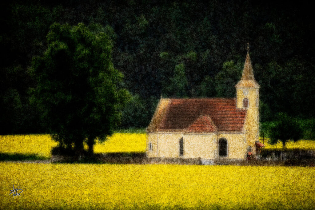 Small church in Moritzreith surrounded by rape blossoms,Austria