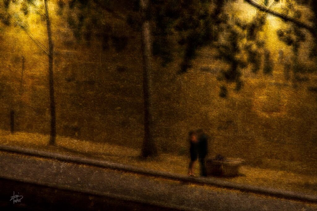 Couple spending a moody evening on the banks of the Seine in paris