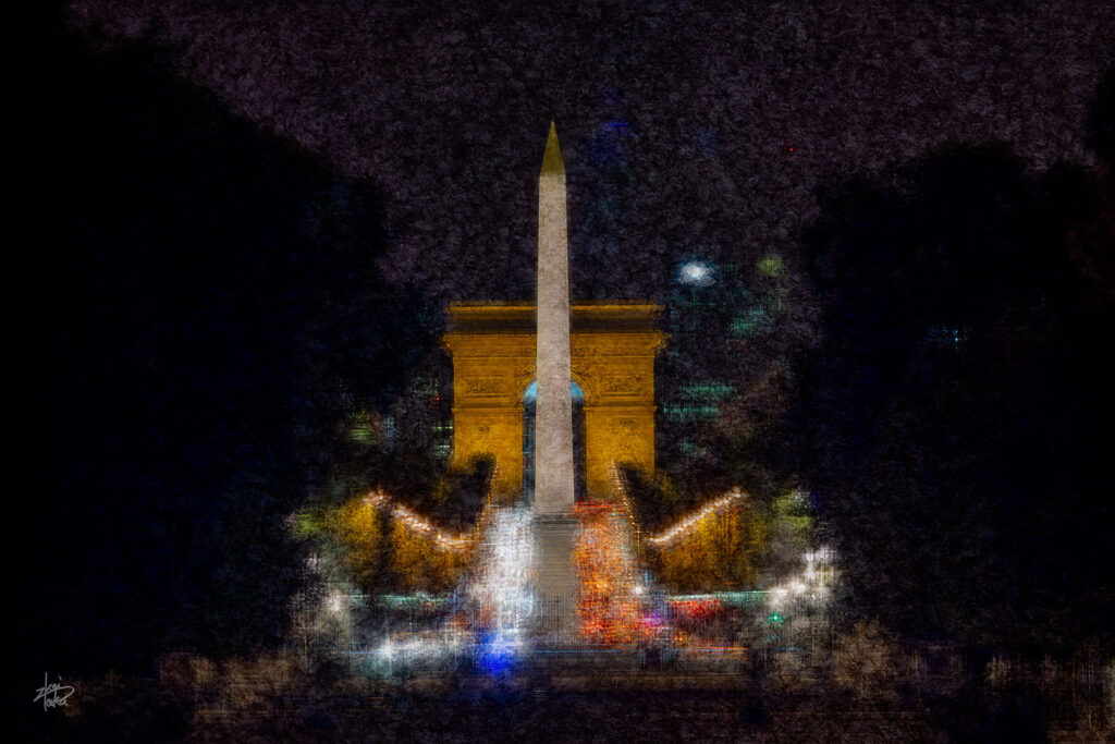 Avenue des Champs Elysées, Arc de Triomphe and Obelisk at night as seen from the Jardin des Tuileries,Paris