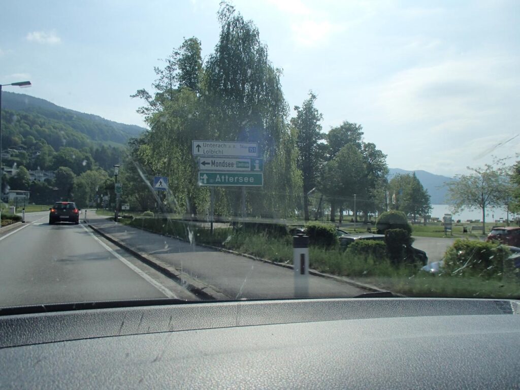 Driving on a road with a view of the Attersee lakeside