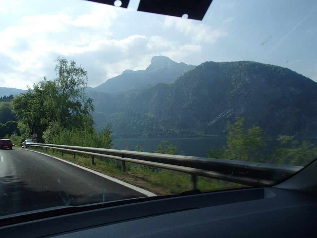 Driving on a road with a view of the Attersee lakeside